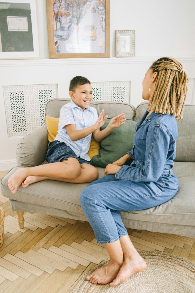 A joyful scene of a mother and son spending quality time together indoors.